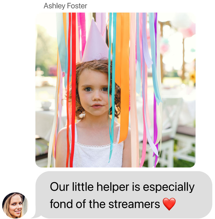 mms of little girl with pink party hat standing in multicolored streamers. Her mom, Ashley Foster, says: Our little helper is especially fond of the the steamers with heart emoji